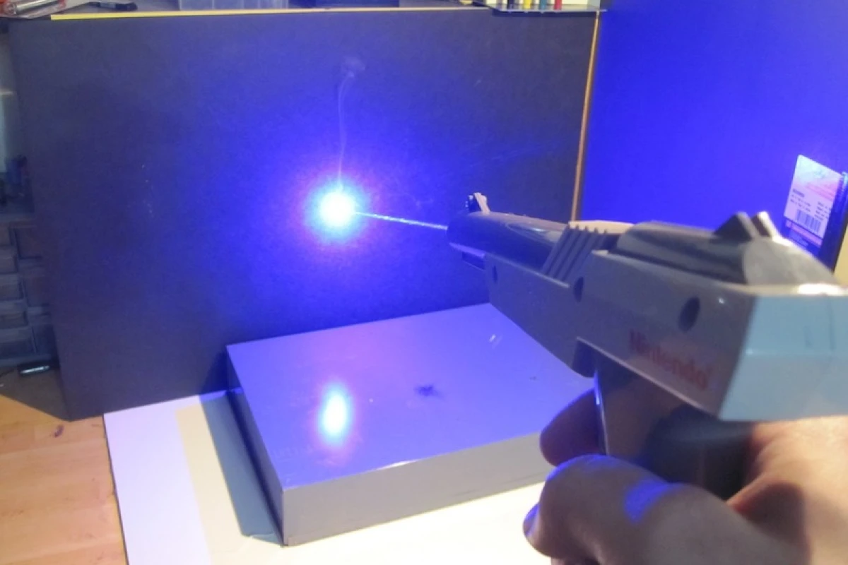 A hacker has retrofitted a classic NES Zapper with a powerful laser, resulting in a gun that is anything but a toy