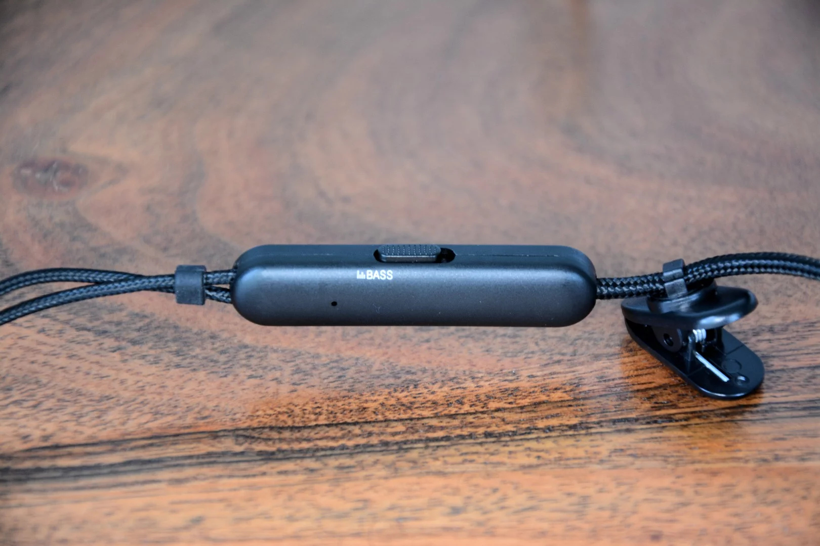 The OVC H15 earphones have a bass boost button on the inline remote located just below the Y joint of the cable