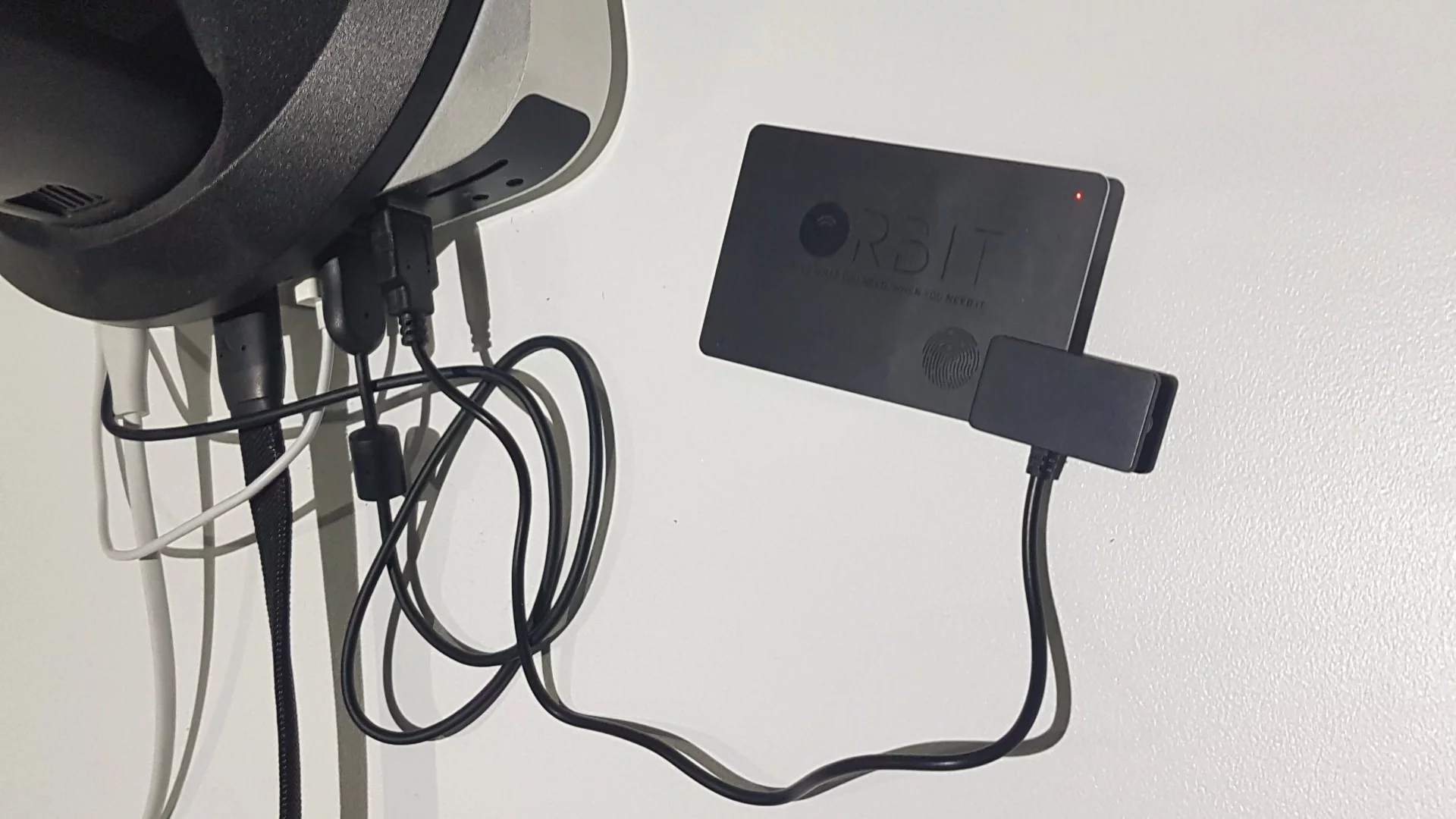 The Orbit Card's internal battery can be charged via USB, thanks to a clamp-like attachment