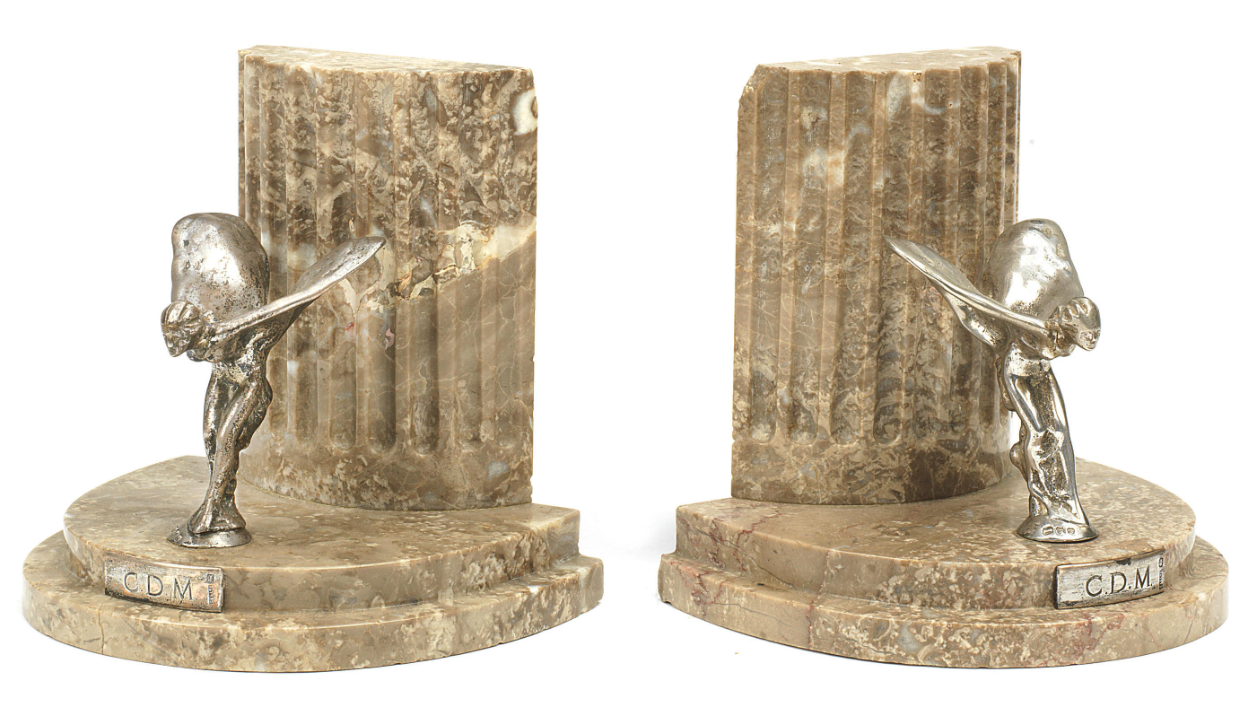 Auction Link: Bonhams | Estimate: €1,800 to €2,800 | Marble book-ends mounted with Sterling Silver Rolls-Royce 'Spirit of Ecstasy' mascot by Saunders & Shepherd. One of a limited number produced as Christmas presents in 1937 by Rolls-Royce for the Managing Directors of principal Rolls-Royce distributors.