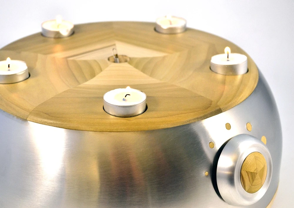 Switch Candle is a deceptively clever candle holder which lights and extinguishes tealights by itself