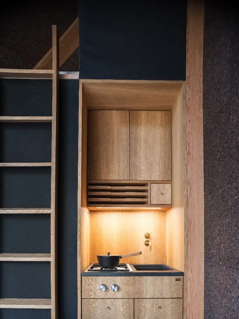 A45's interior includes a wood-burning fireplace, kitchenette, and a dining area