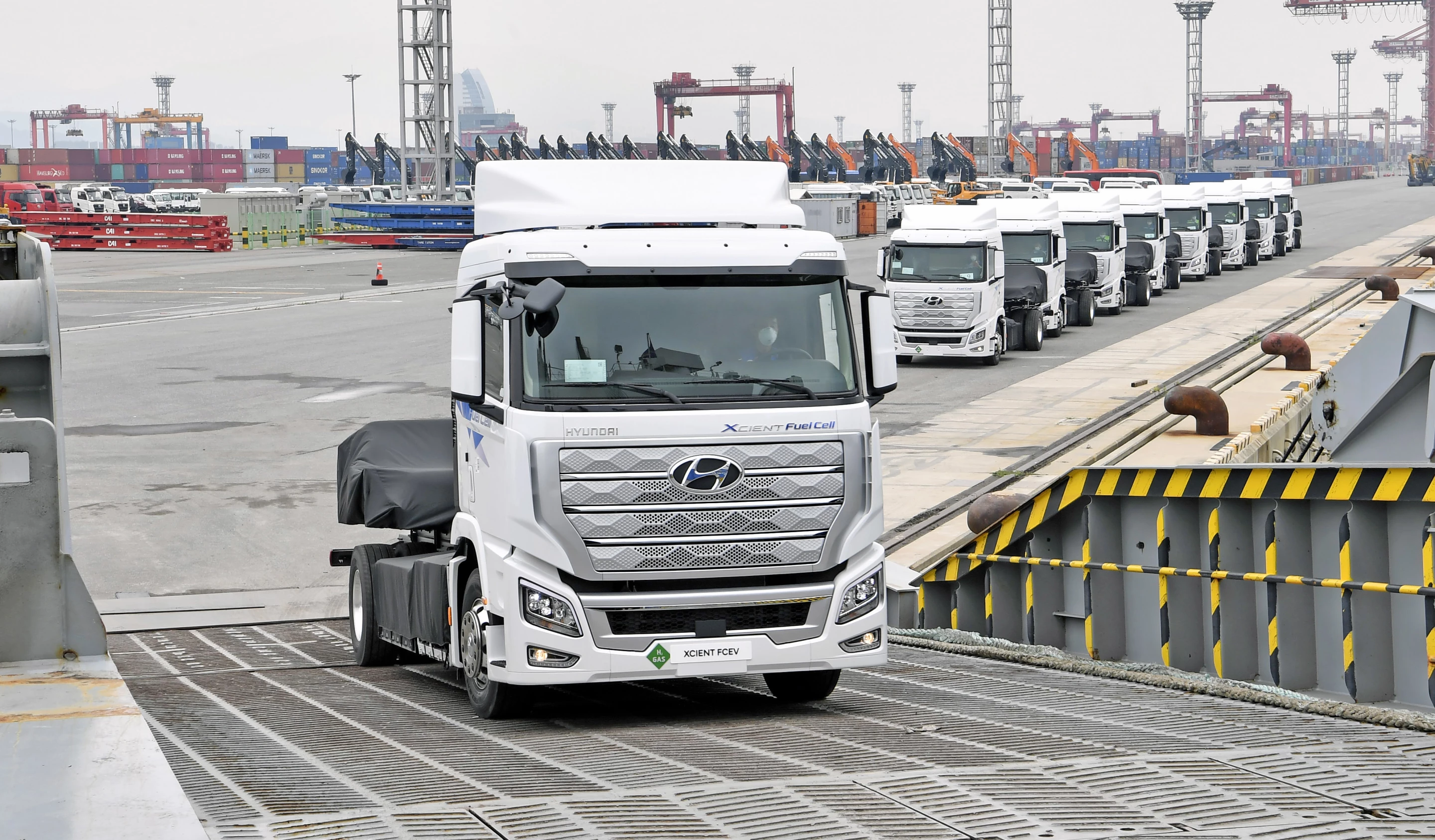 The first 10 hydrogen powered Xcient Fuel Cell trucks board a ship in Korea headed for Switzerland