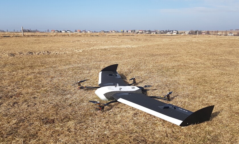 The FlyTech VTOL module is quickly attached by hand to the underside of an off-the-shelf Birdie, where its detachable wings join its body
