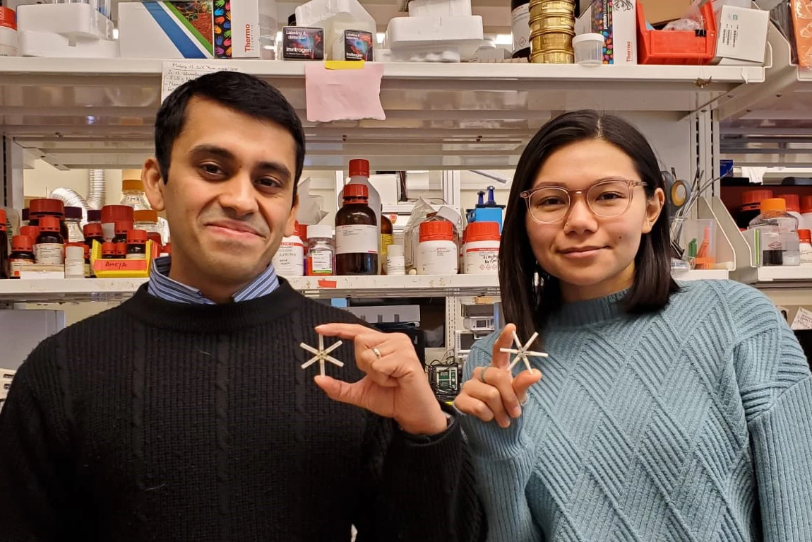 Researchers Ameya Kirtane (left) and Tiffany Hua (right), with the star-shaped drug delivery system
