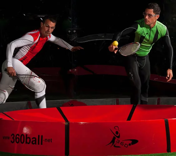 In the new racquet game of 360ball, players hit a ball into a central concave dish, trying to rebound it out of the reach of their opponents