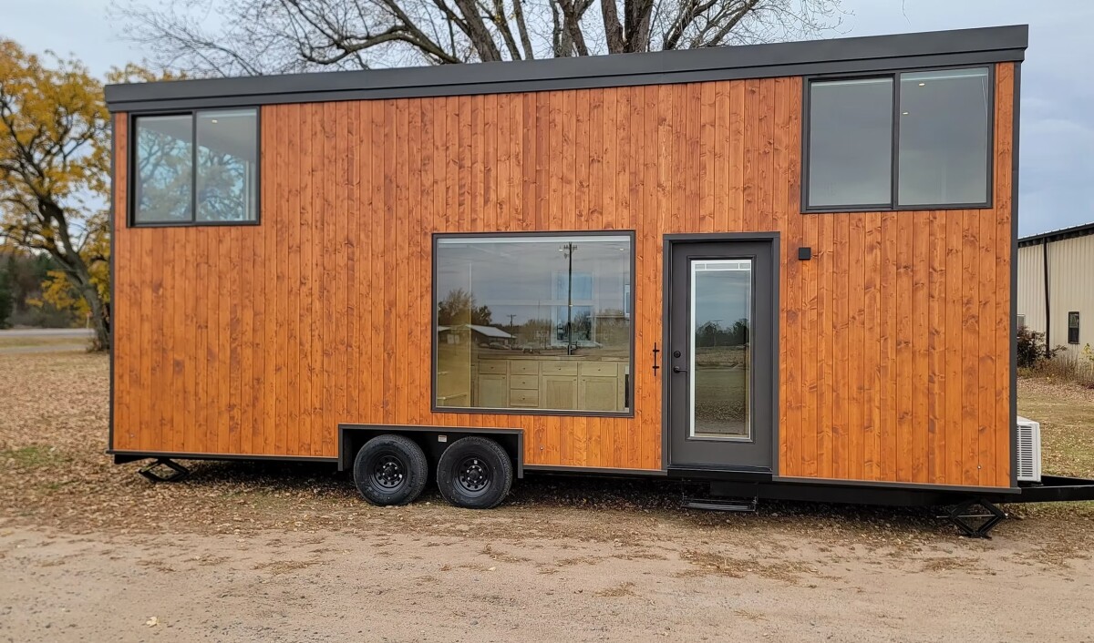 Tiny house goes wide and tall for a comfortable life on wheels