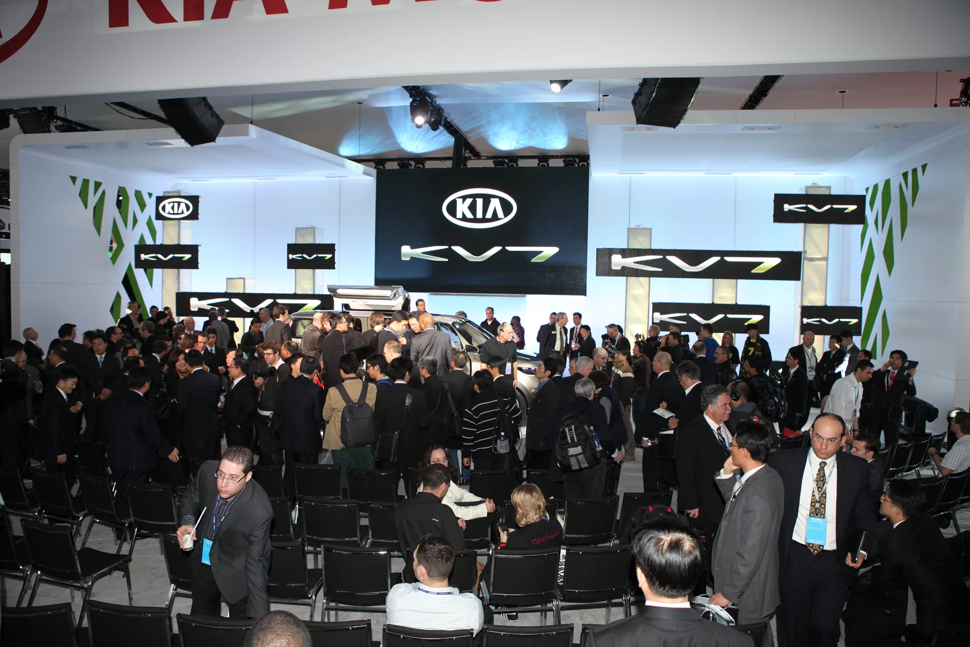 The media pack surrounds the Kia KV7 Concept at its unveiling in Detroit
