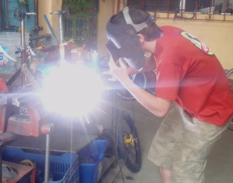 Jon Leary working on his mobile bicycle-powered pump