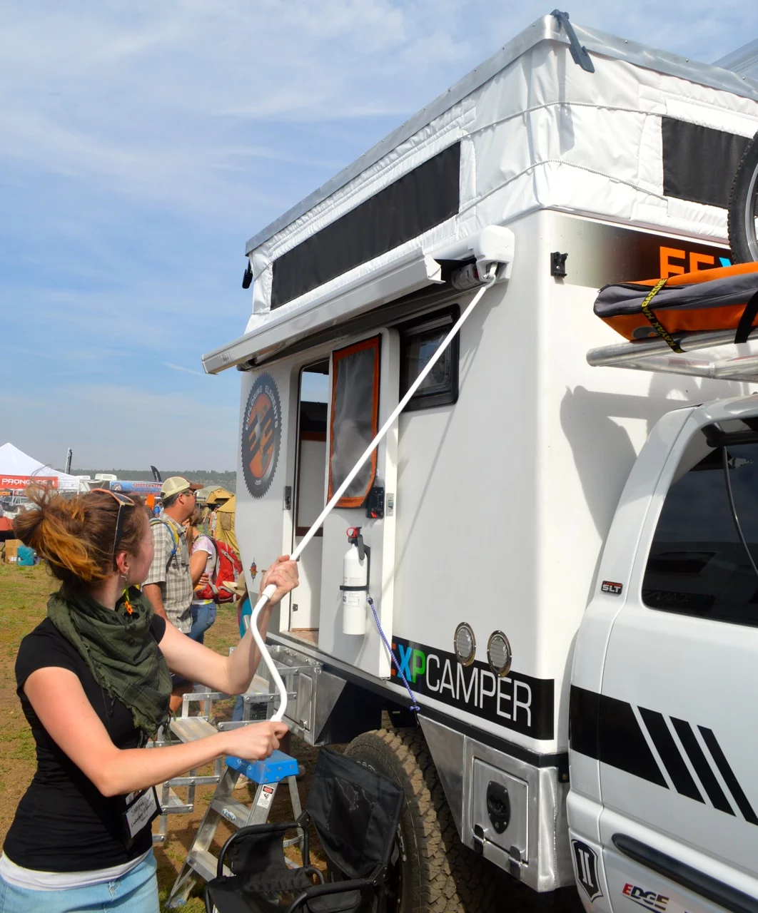 One of the EEXP's residents, Sarah Blessington, opens the awning (Photo: Gizmag)