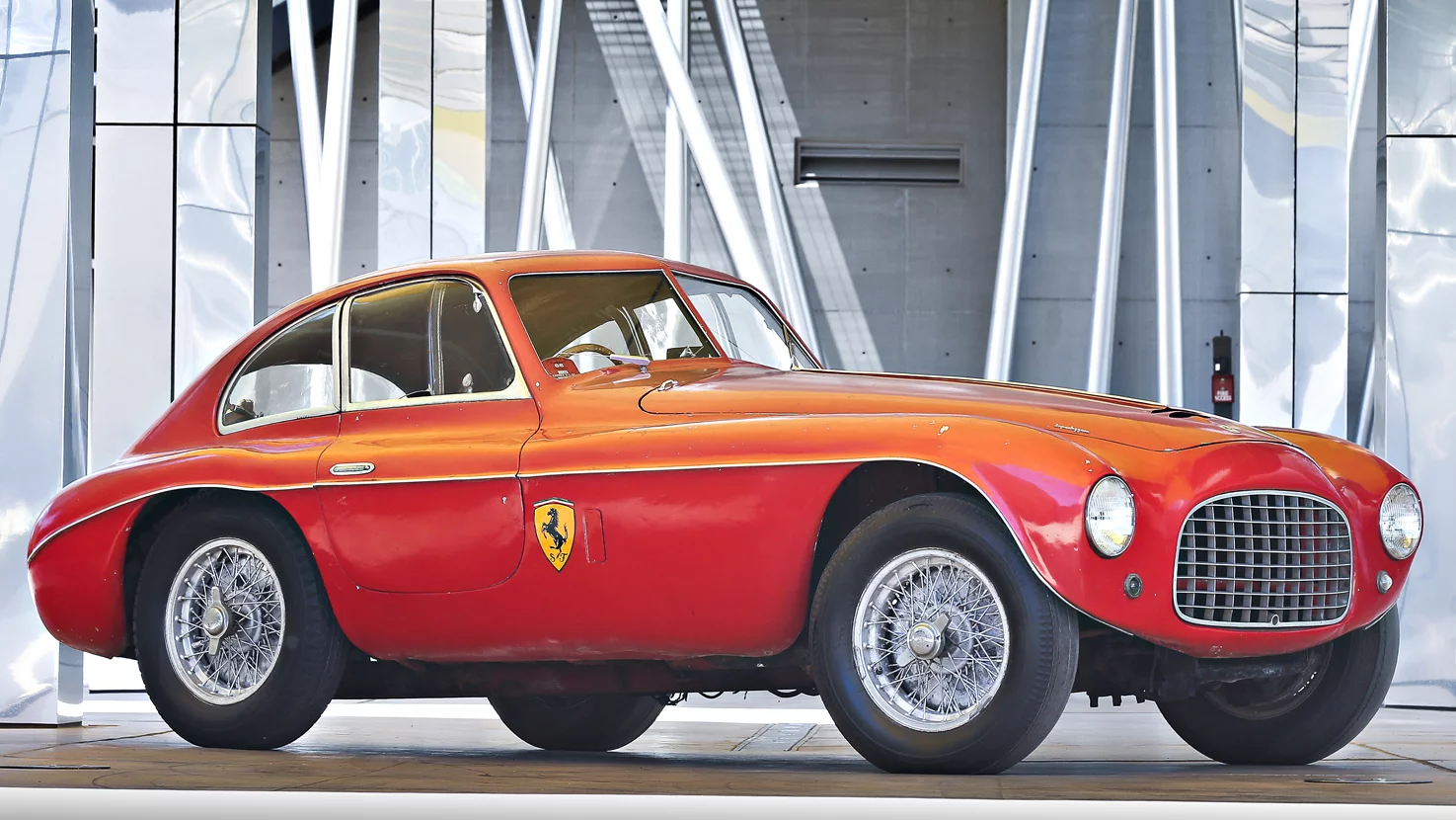 It was the Tipo 166, introduced in 1948 that first established Ferrari as a leading manufacturer of racing cars. While the earliest 166 Sports and Spider Corsas were successful in their own right, it was the 166 MM (Mille Miglia) that dominated sports car racing in the late 1940s and early 1950s. The 166 MM is the only Ferrari to win all three of the great European sports car races: the 24 Hours of Le Mans, the Targa Florio, and the Mille Miglia. This car is an unrestored and historically significant competition Ferrari driven by Nuccio Bertone in the 1950 and 1951 Mille Miglia and by Emilio Giletti to a win in the 1952 2-Liter Italian Sports Car Championship. The car sold at Gooding & Co's official Pebble Beach auction for $5,445,000