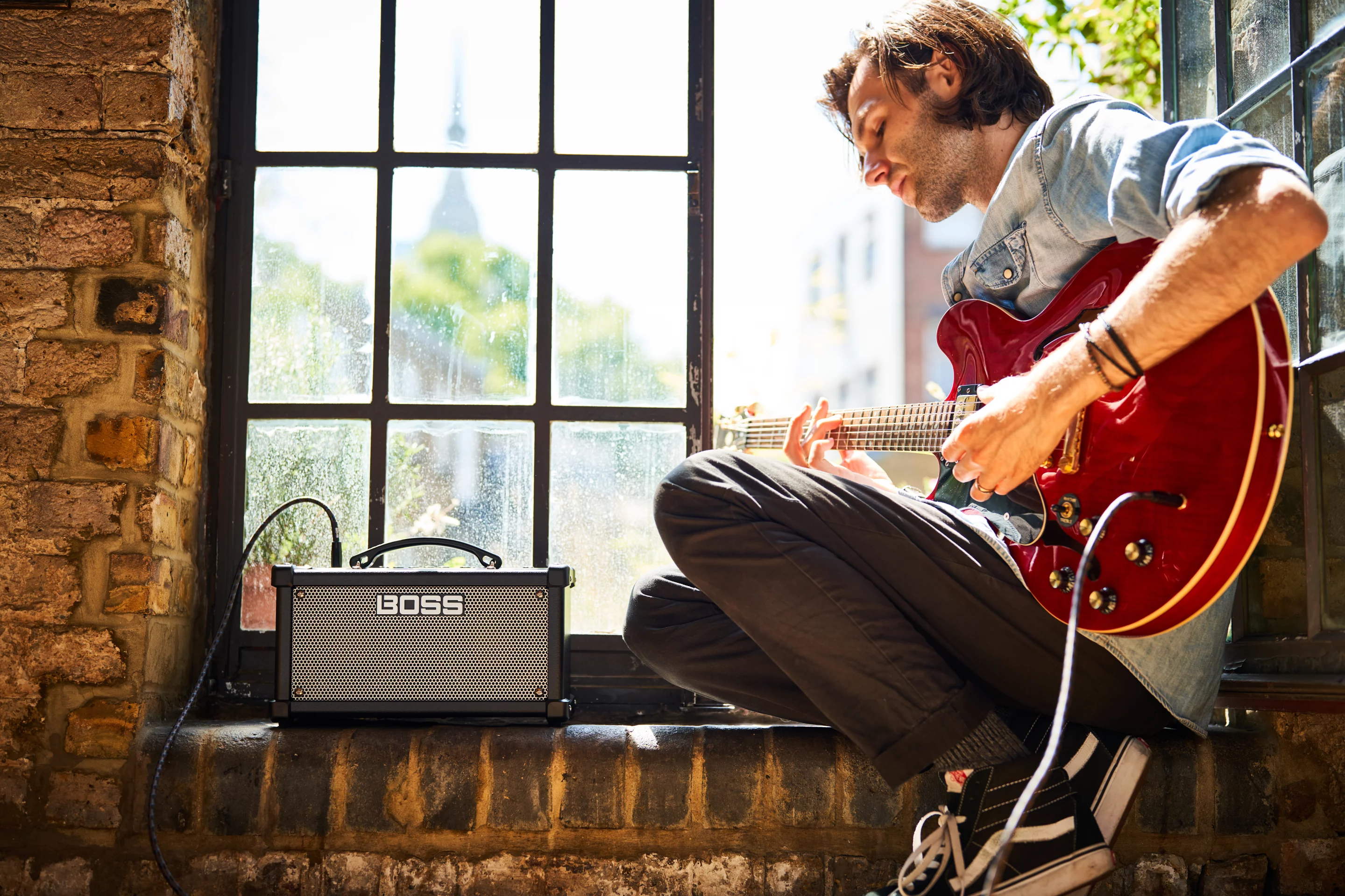 The Boss Dual Cube LX practice amp features two 5-W speakers, a bunch of amp emulations and onboard effects, and can be powered from a wall outlet or by batteries