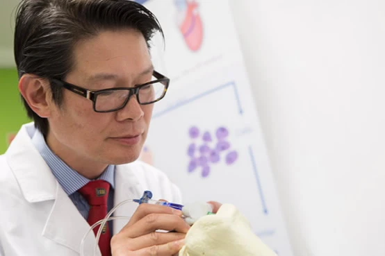 Professor Peter Choong tries out the new BioPen