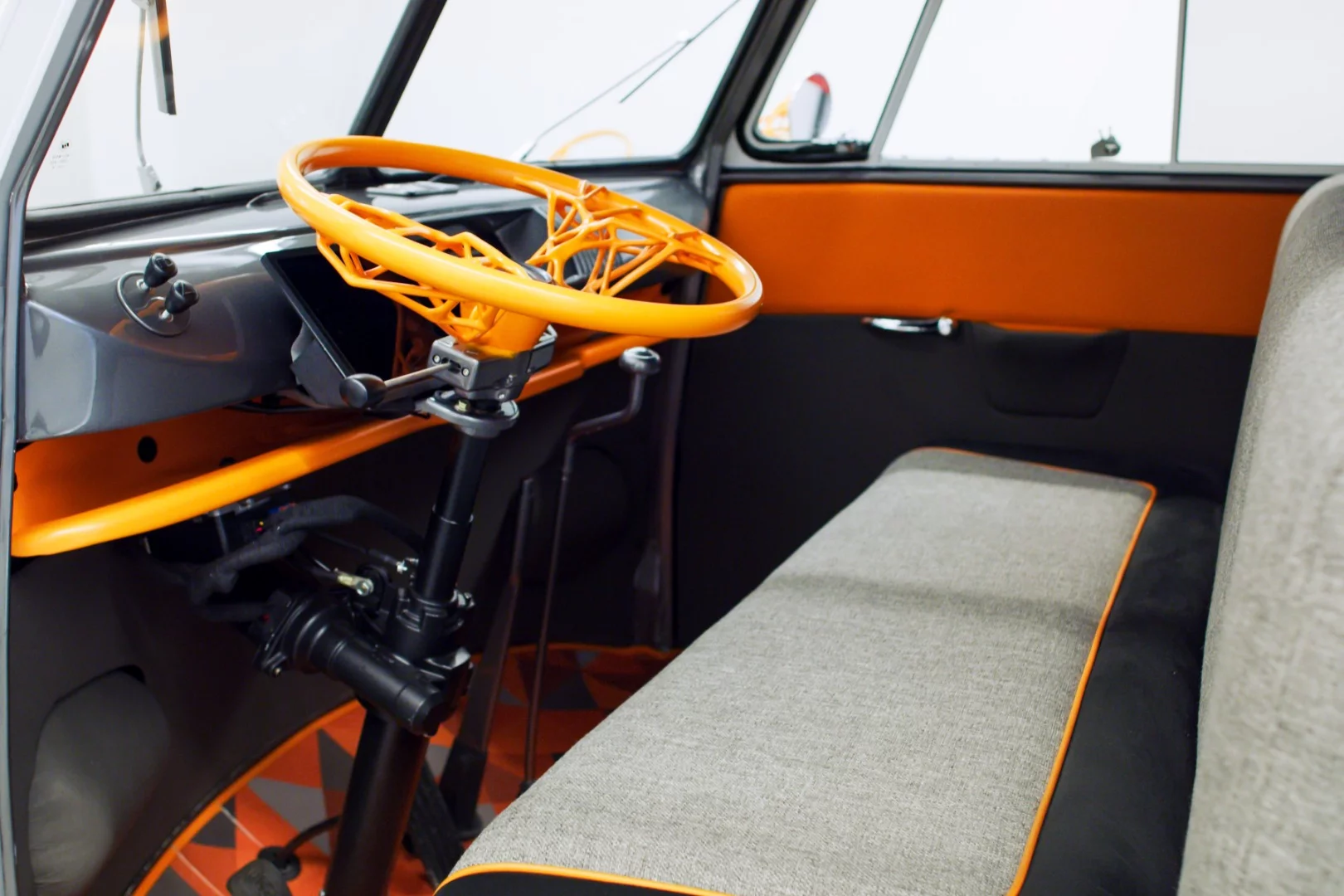 The vintage driver's area gets upgraded with new technologies like a holographic display and voice command assistant