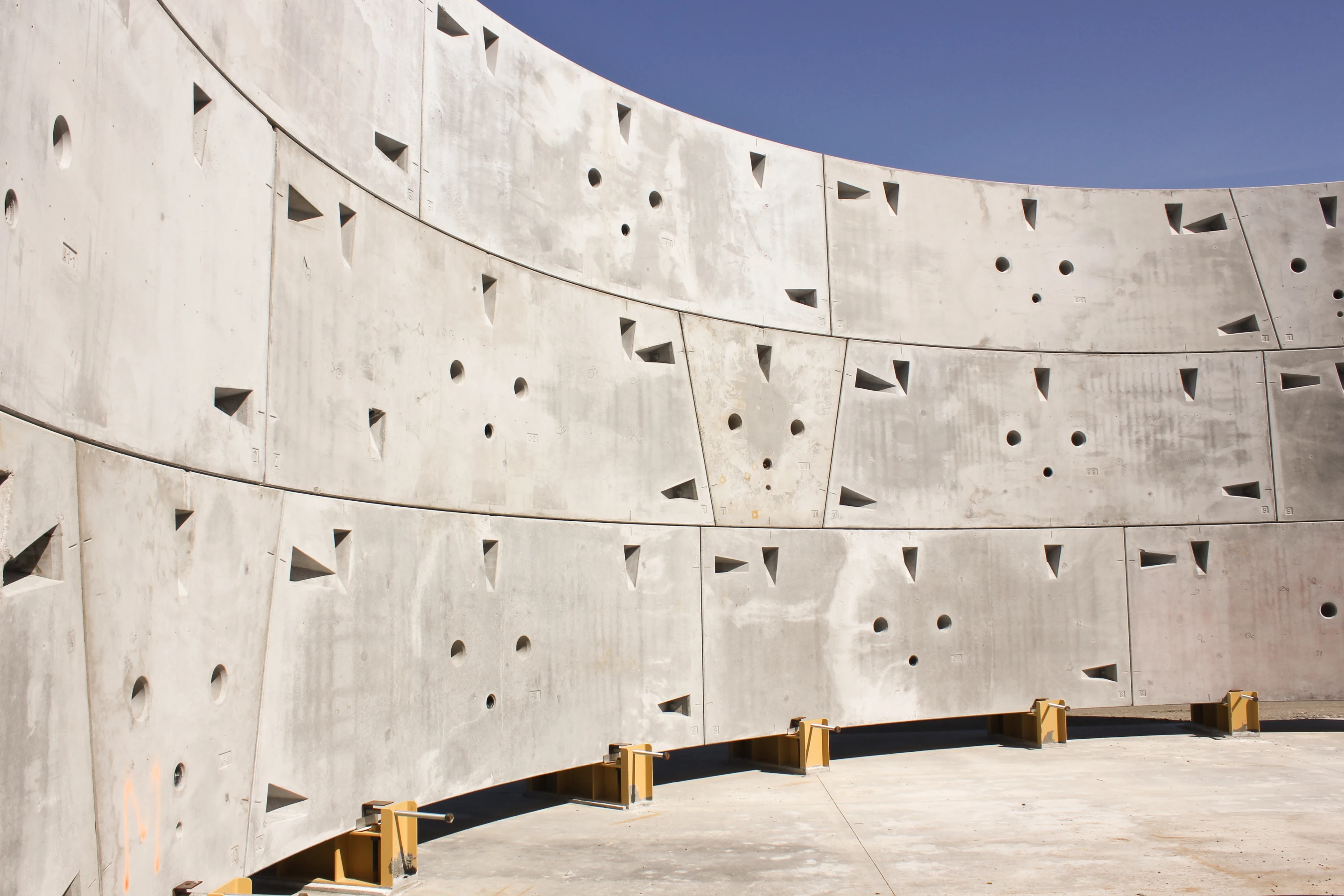 Three concrete rings assembled on the surface to show how the tunnel lining is assembled and bolted together (Image: WSDOT)