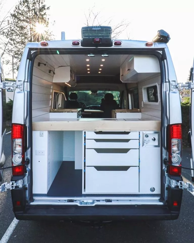 Instead of an open under-bed garage like many camper vans have, the Freedom Chongo has a neat, organized stack of drawers along with a smaller cargo space