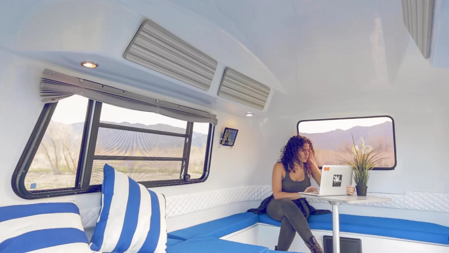 The Happier Camper HC1 travel trailer has snap-down blinds for privacy