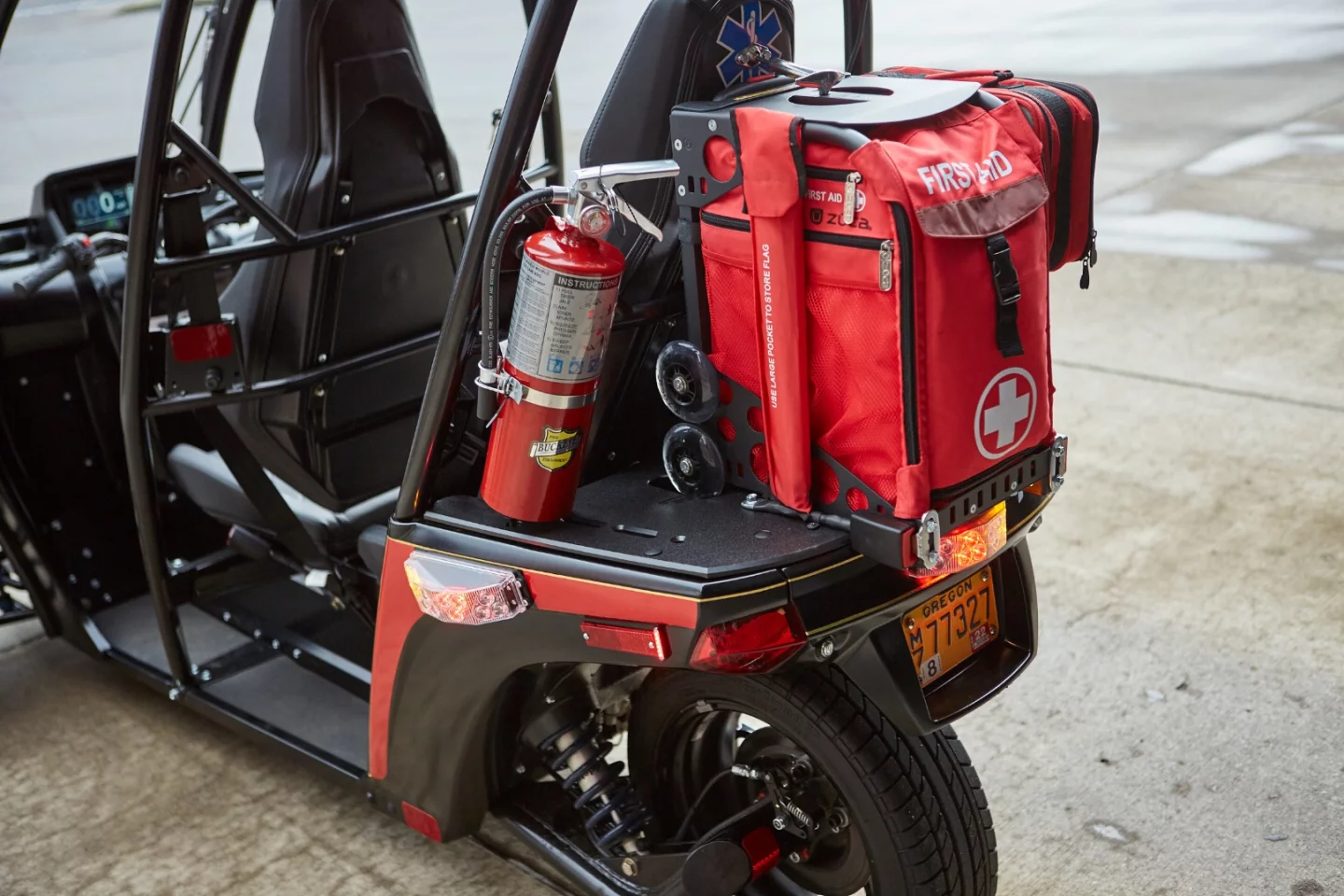 The lockable storage on the consumer-focused Evergreen Edition electric three-wheeler has been sacrificed in the Repaid Responder version, to make room for first responder equipment