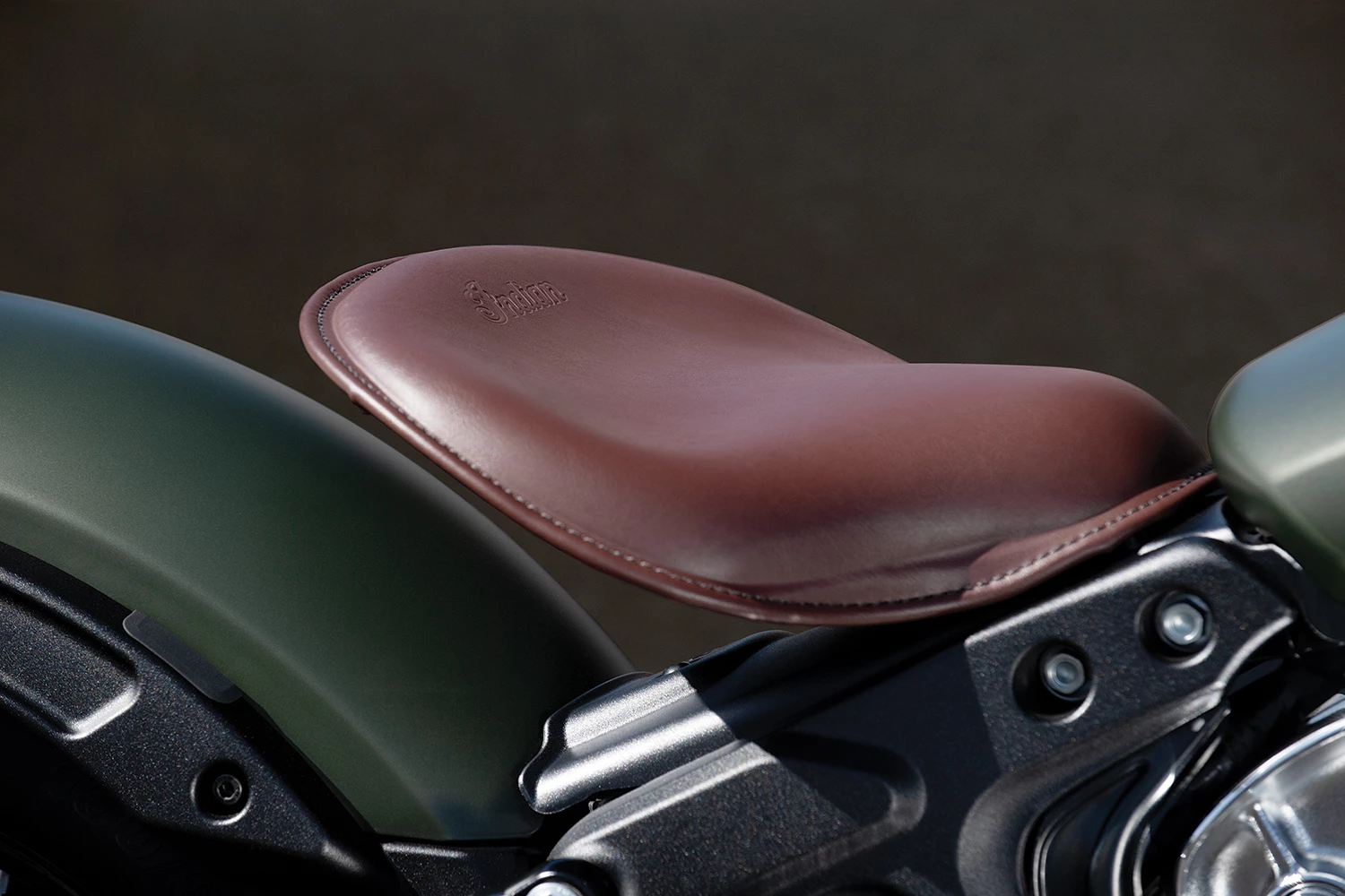 The Bobber Twenty's floating, brown leather saddle