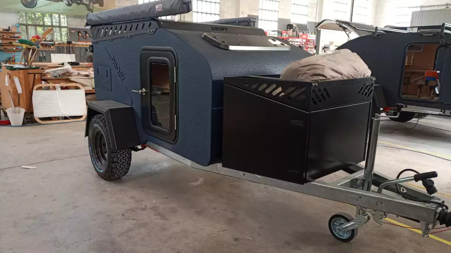 The available aluminum front storage box stores the optional fridge