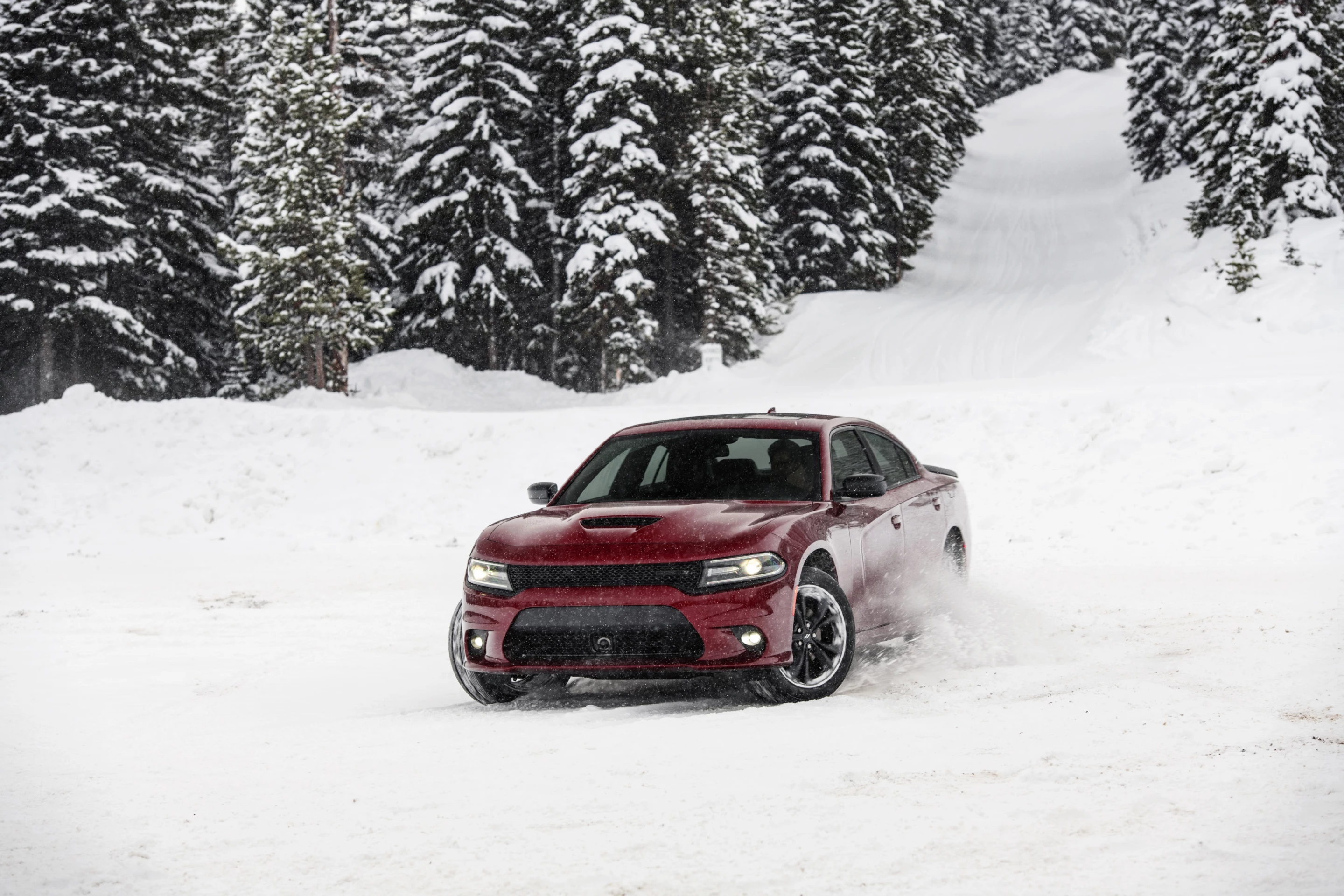 On the snow and ice of Colorado, in controlled conditions, we saw how much fun a big car like this can be to throw around