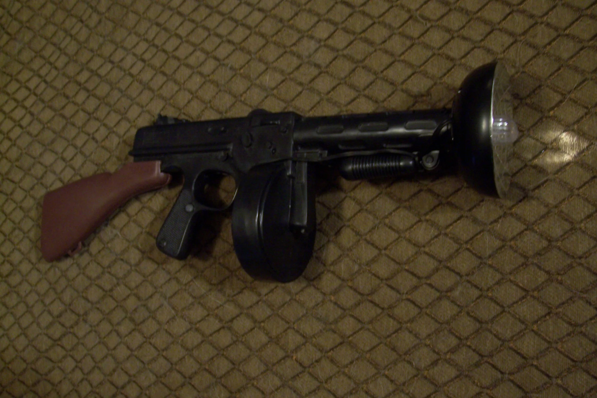The Eye's Strobo-Gat, a re-purposed 1920's style costume Tommy gun with a strobe flash built into it