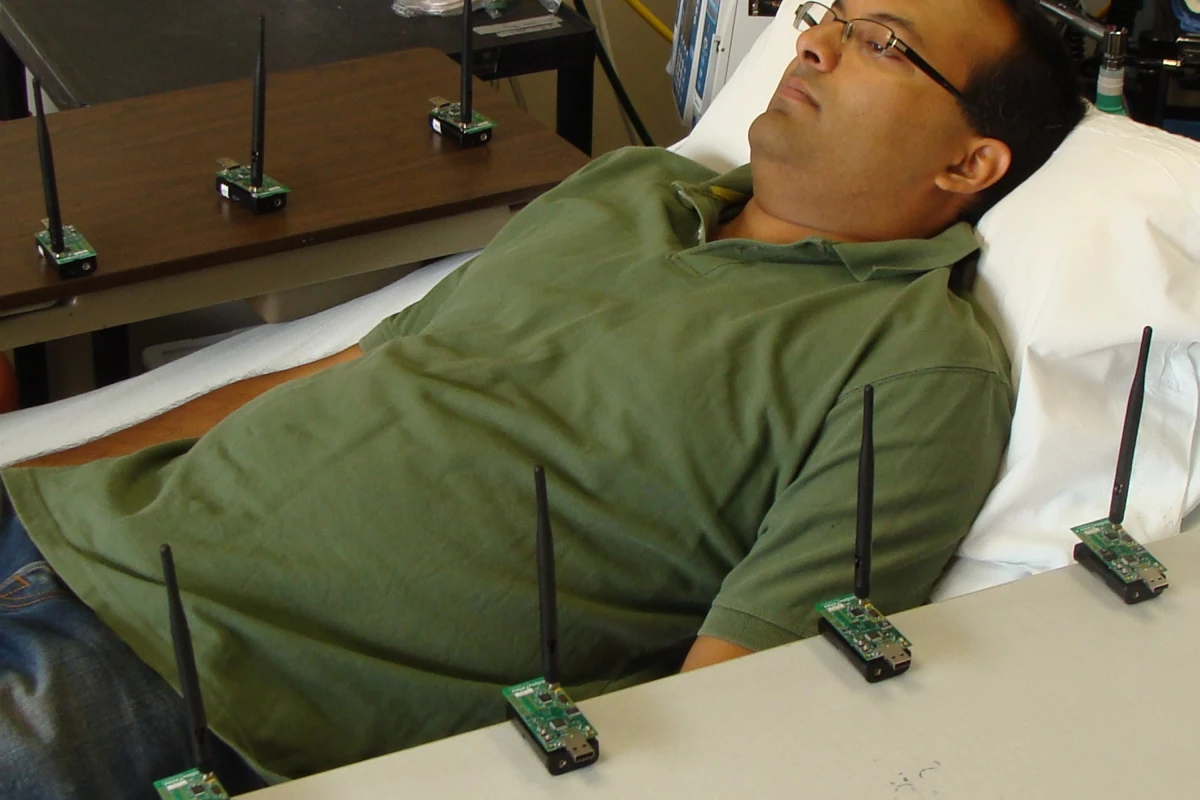 Electrical engineer Neal Patwari testing his wireless respiration-monitoring system