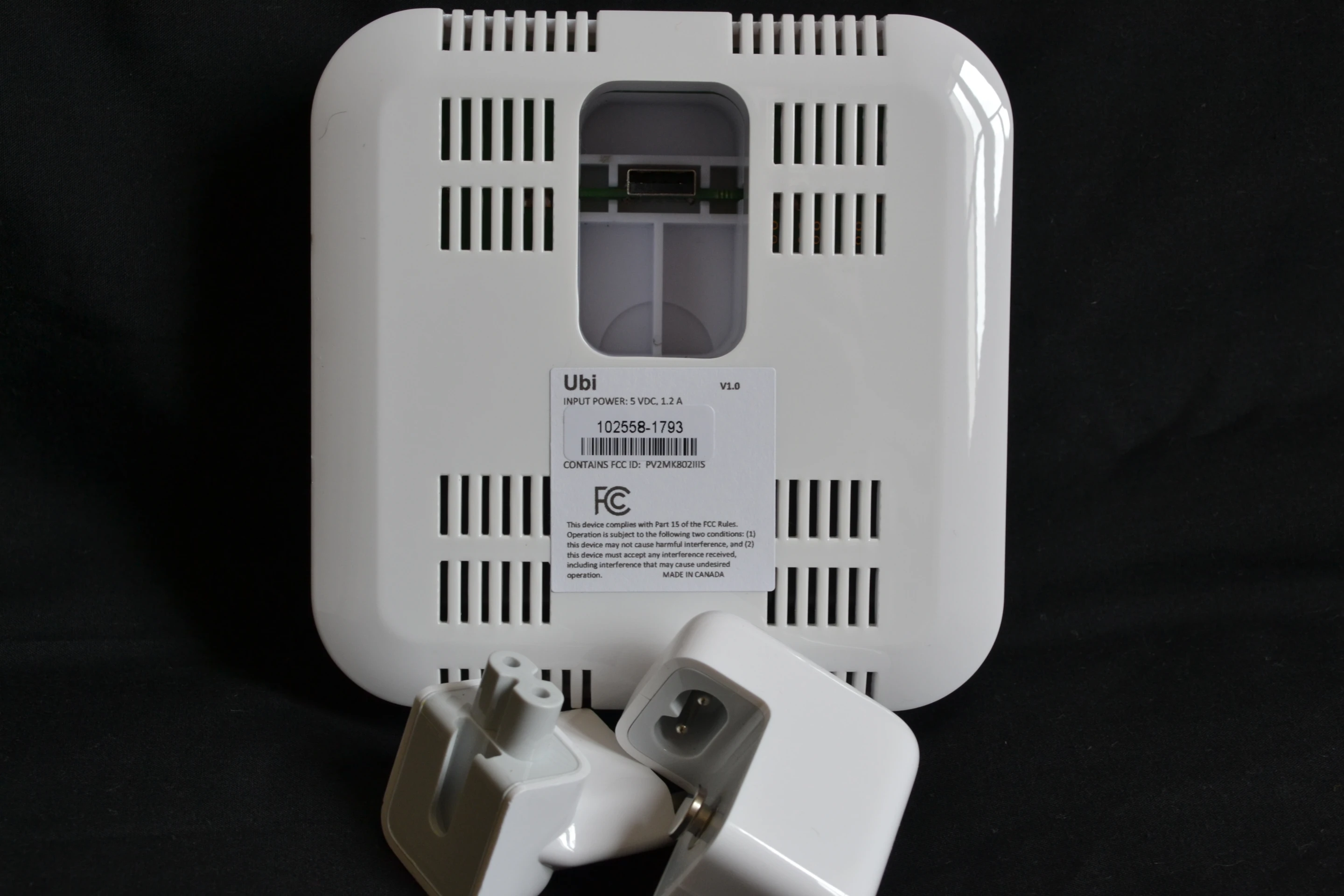 The power adapter slots into the back of the housing before the unit is plugged straight into a wall outlet
