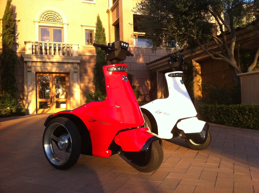 The T3 Power Sport three-wheeled electric vehicle features hot-swappable battery packs with a range of up to 40 miles, and a front-wheel-drive electric motor with four user-controlled speed settings