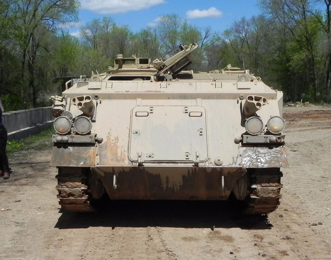 From the front, the APC has a driver's chair to the left and a commander's position just behind that