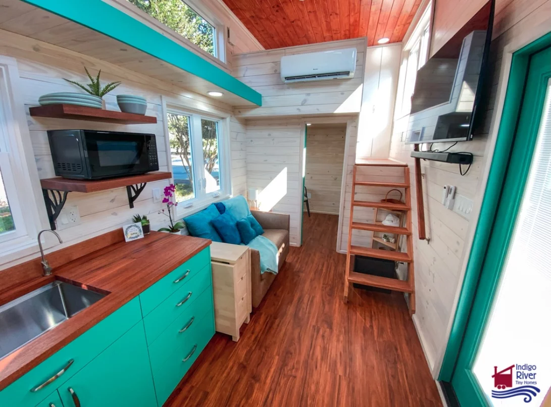 The Sandy tiny house's interior can be finished in either natural pine or birch, with vinyl flooring