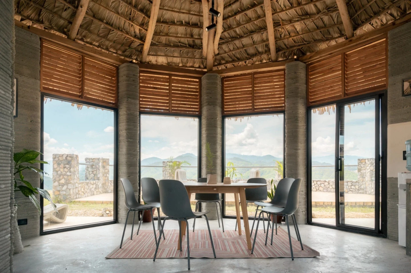 The 3D-printed house has a simple and utilitarian decor that leaves the concrete shell on display