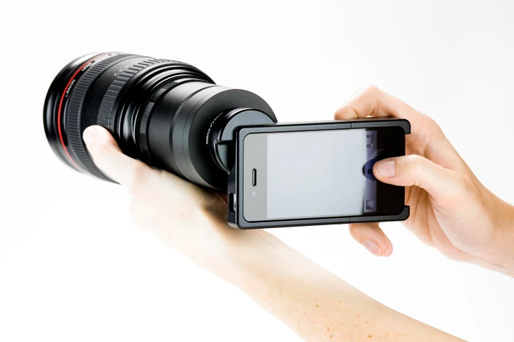 The iPhone SLR Mount comes in either a Nikon F-mount or Canon EF-mount version, and allows iPhoneographers to utilize an SLR lens with the iPhone's camera (Photo: Photojojo)