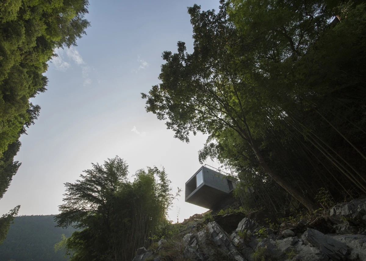 Faced with almost no flat surface to build a structure on architect Masato Sekiya designed an incredible concrete cantilevered cabin. A marvel of structural engineering this small home floats above the Tenkawa river in Japan