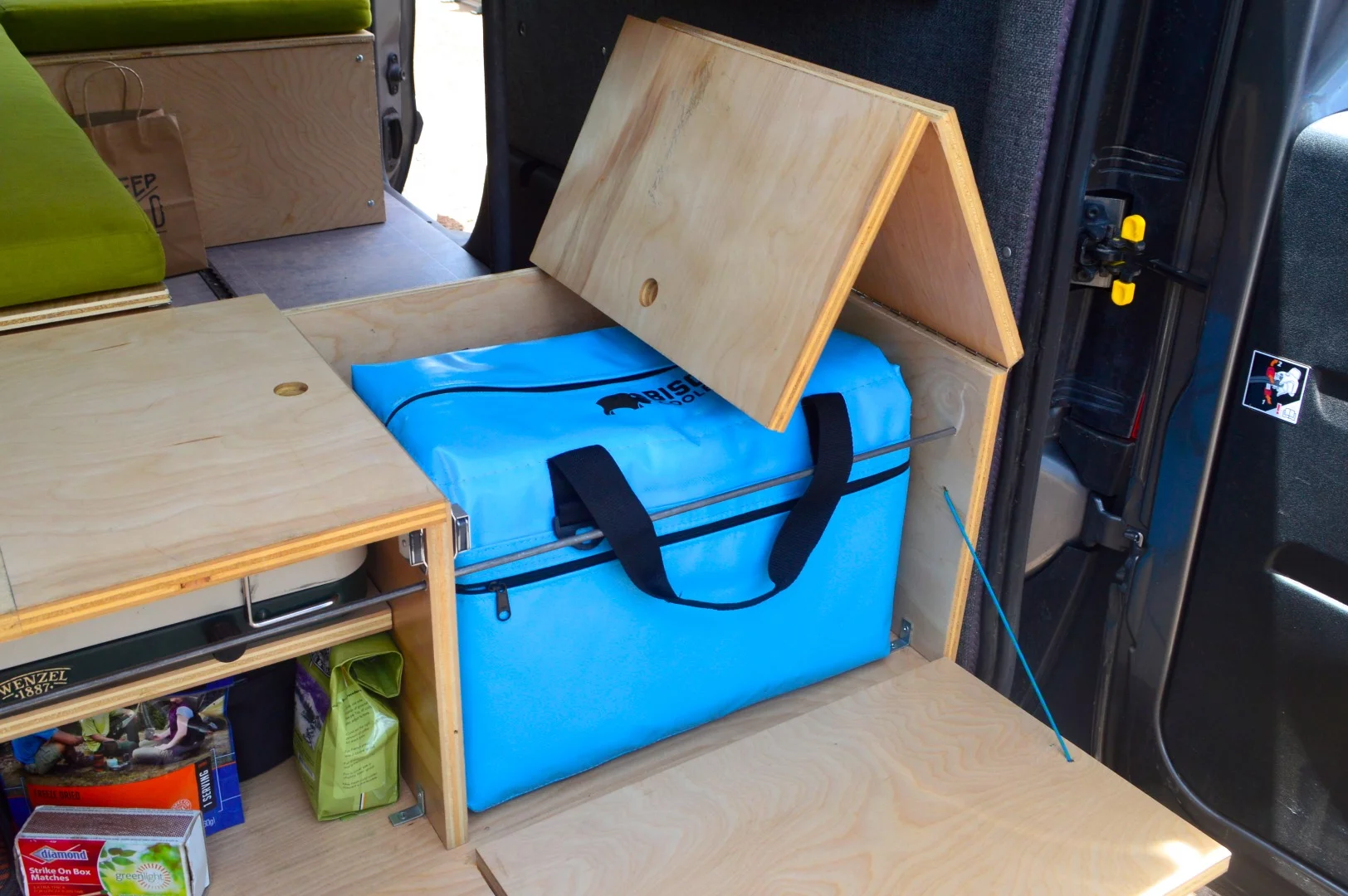 The lack of a 12V fridge option and the small built-in space for a cooler is probably the Wayfarer's weakest point, but you could always pack a larger cooler inside the van cabin