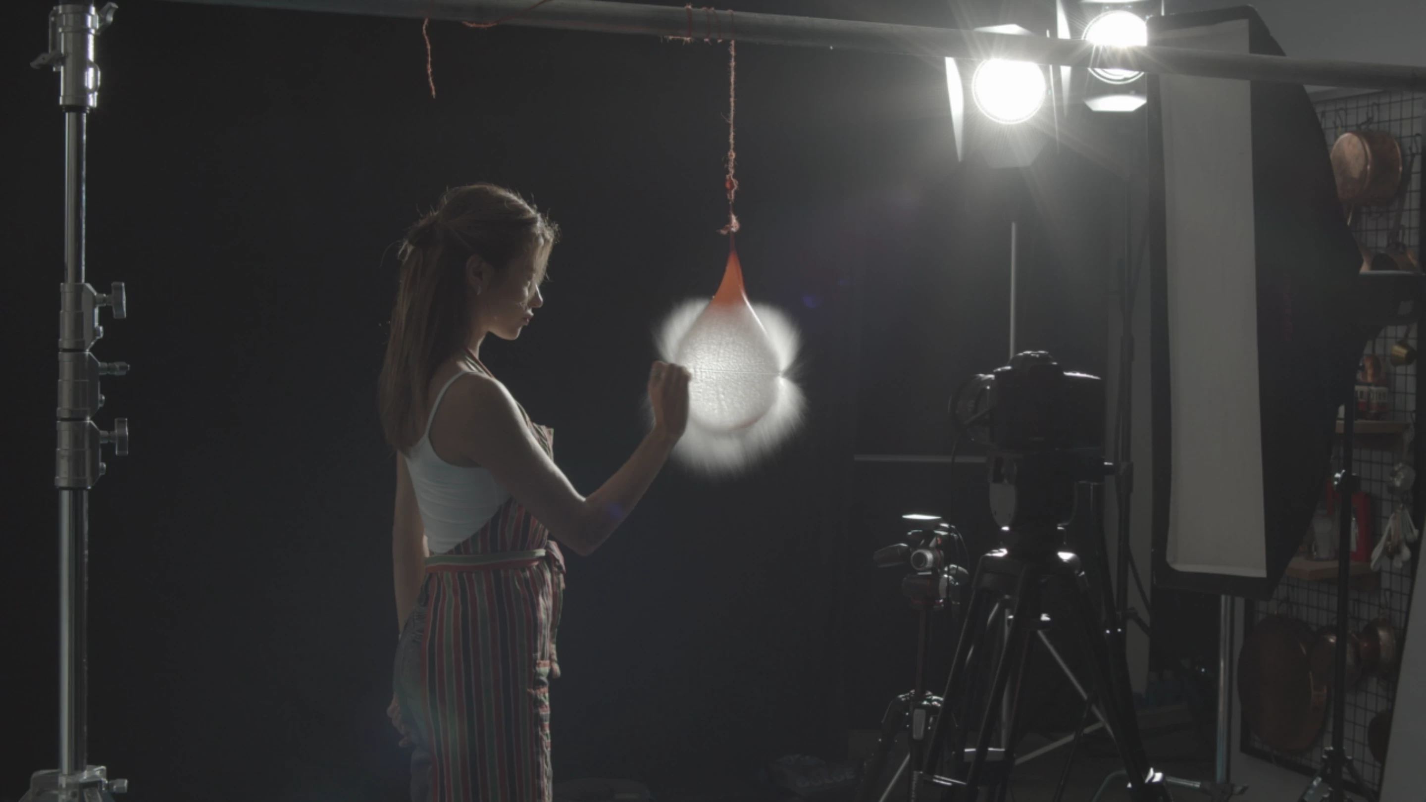 An audio sensor triggers the shot when it detects a sound, such as a balloon being popped