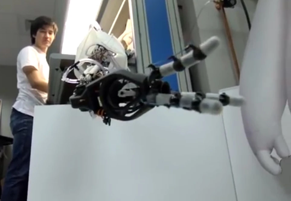 The three-fingered optic sensor equipped robotic hand close up