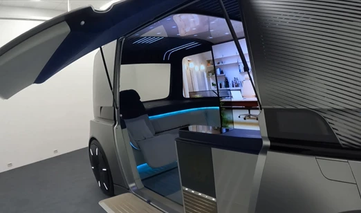 There are a number of different-sized digital displays inside, along with comfy looking benches and swivel chairs, ambient lighting and tech to keep the space spick and span
