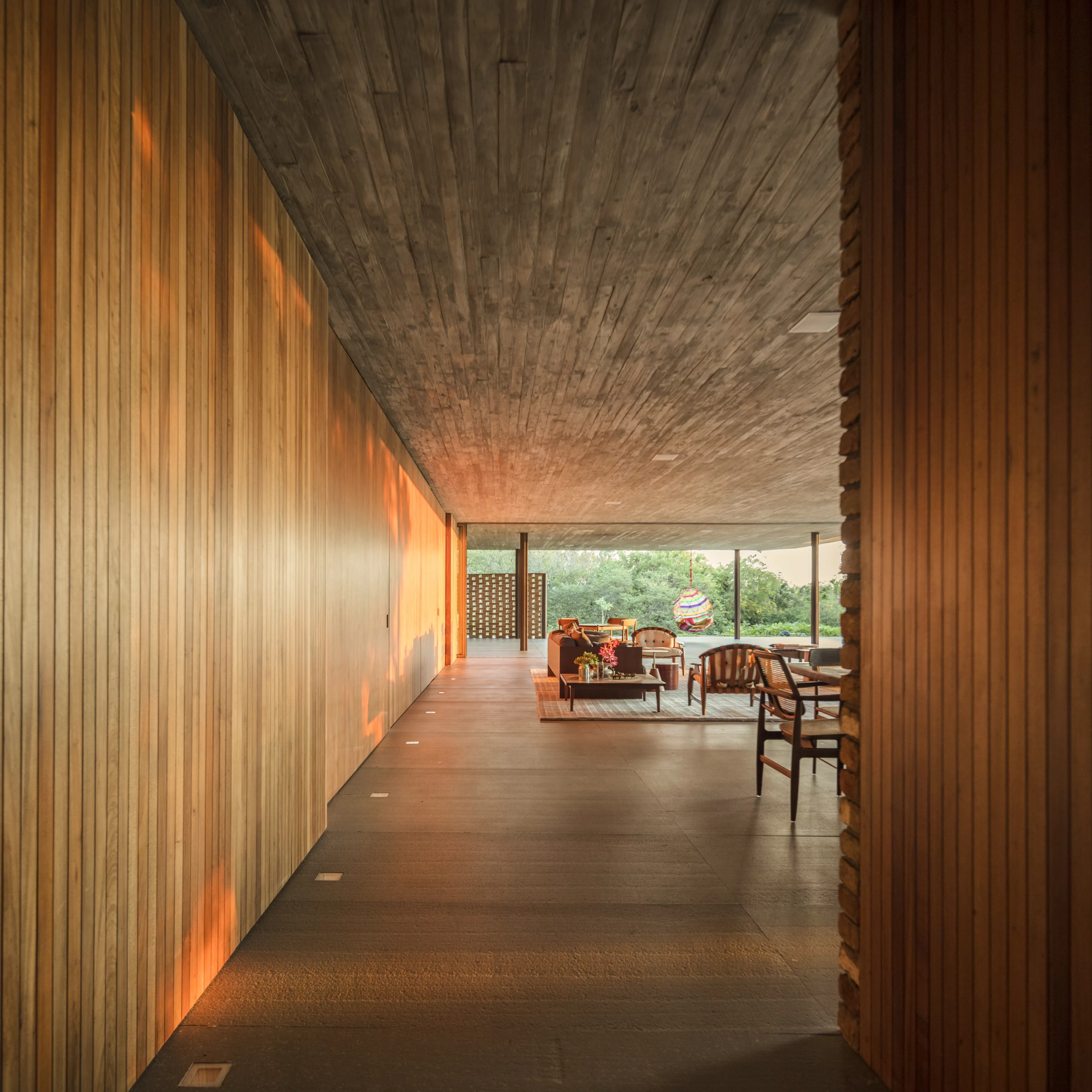 Planar House's large living rooms and dining areas open up to the outside