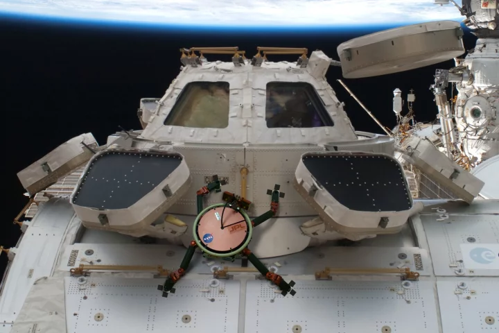 Artist's impression of the LEMUR climbing on the International Space Station's cupola