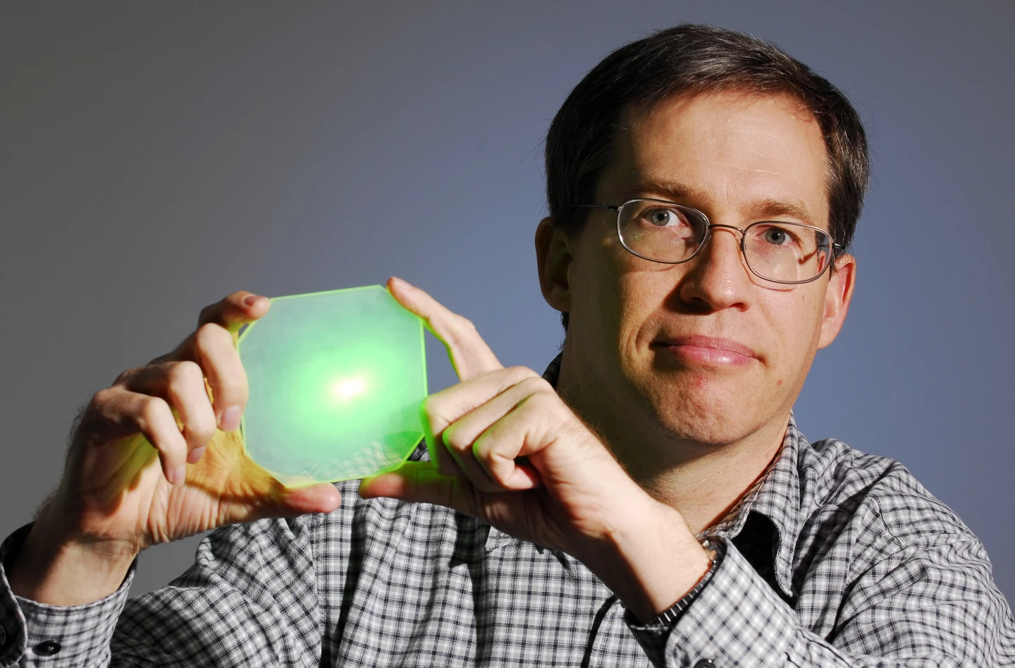 Georgia Tech's David Roberts with one of the laser testing glass boards