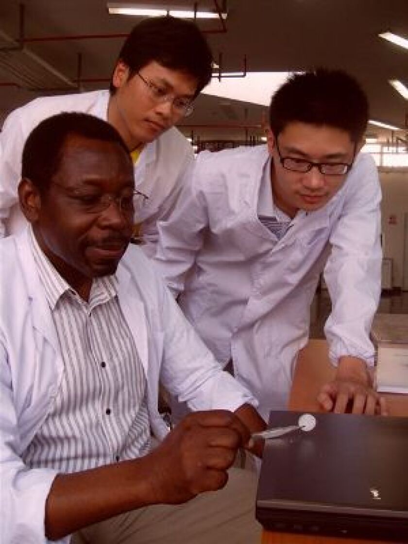 Professor Jo Darkwa, Research Associate Oliver Su and PhD student Tony Zhou with their heat-regulating material
