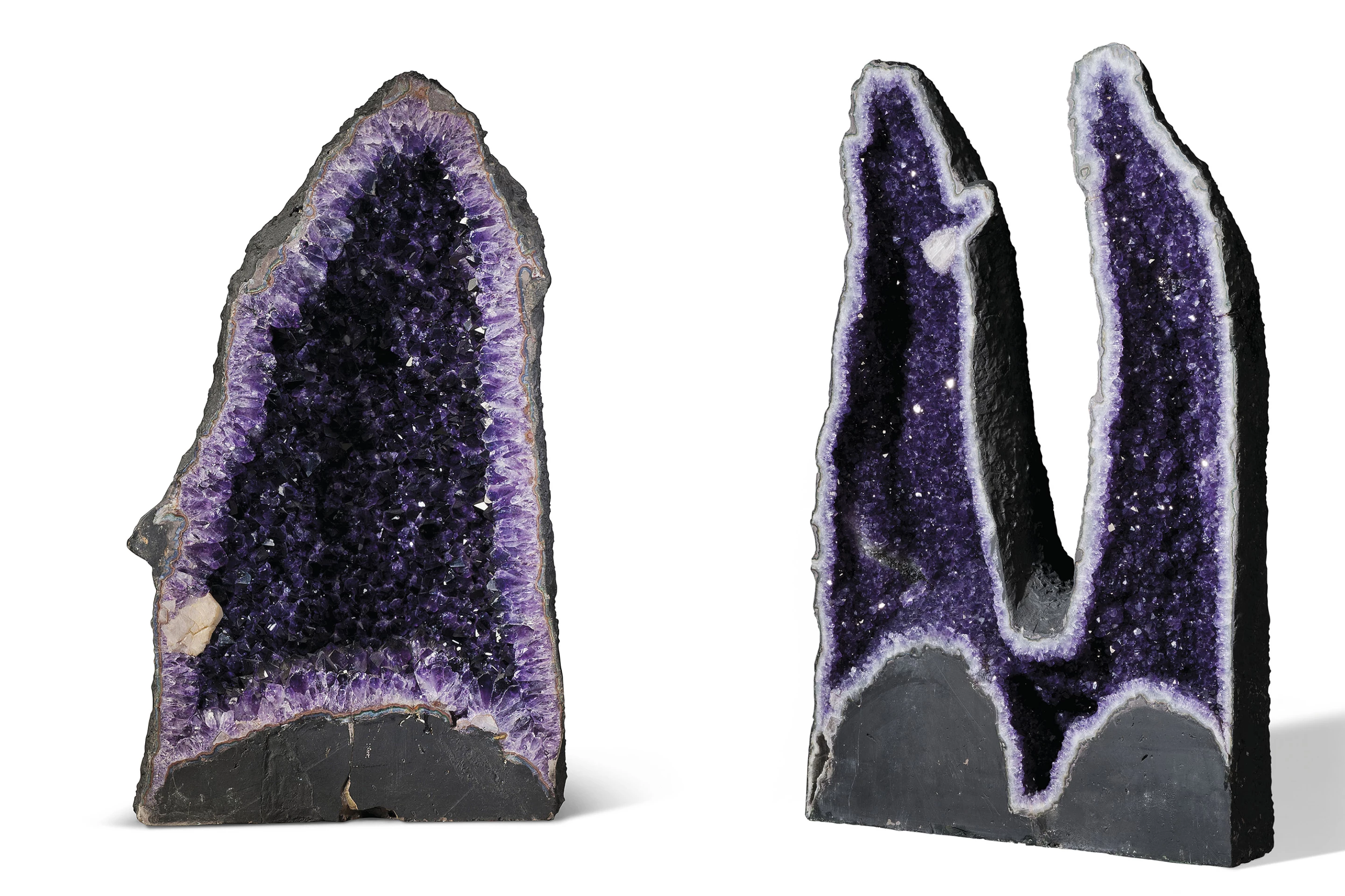 Amethyst Geodes are far from rare, and can be found all over the world within volcanic rocks, though large and beautiful examples command a premium. These two examples are both from the Rio Grande Do Sul region of Brazil, one of the world’s most abundant resources of amethyst. They stand 31 inches (78.5 cm) and 34 inches (87 cm) tall respectively.