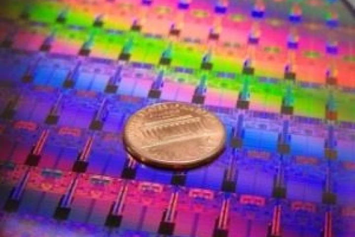 Processors on an Intel 45nm Hafnium-based High-k Metal Gate ''Penryn'' Wafer photographed with a penny