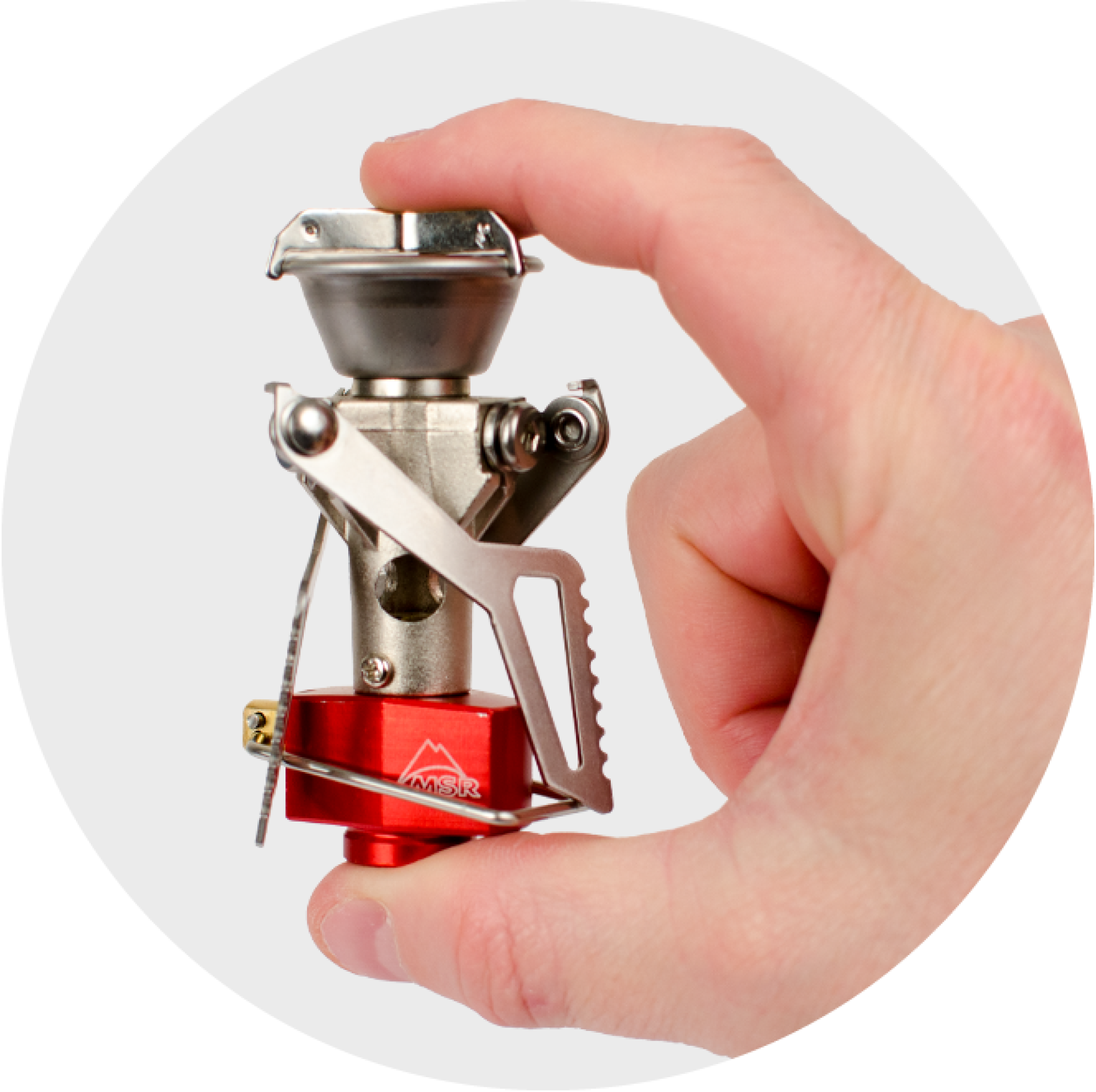 Tiny, cylindrical Primus backpacking stove packs smaller than a can of