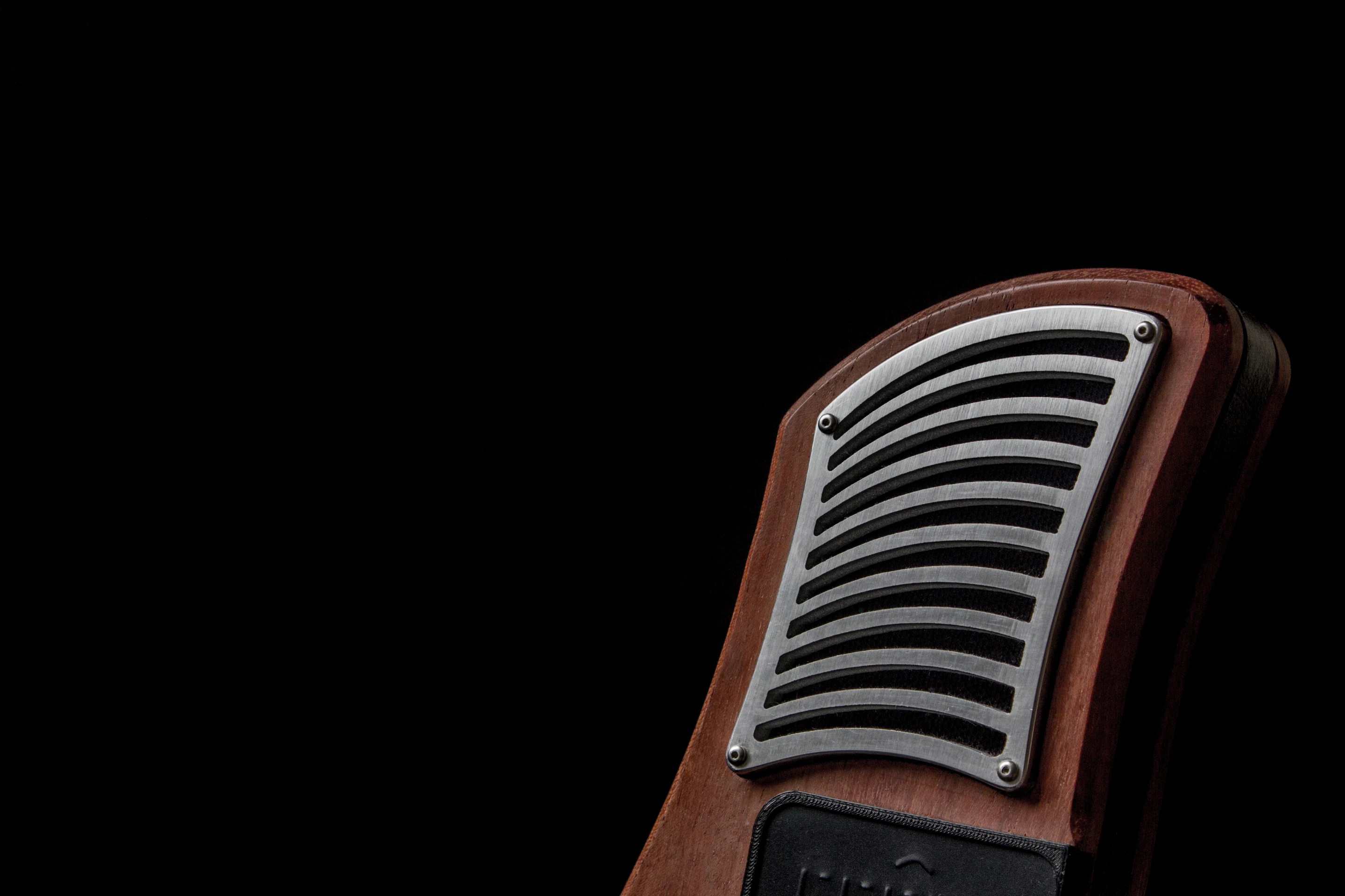 At either end of the ergonomic body fashioned from sustainably-harvested hardwoods and bamboo are BMR speakers
