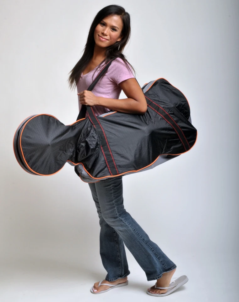 The VeloMini folding electric bike in its carry case