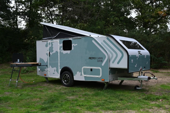 At camp, the Aero Cabin explodes in size with a slide-out front, pop-up roof and indoor/outdoor kitchen