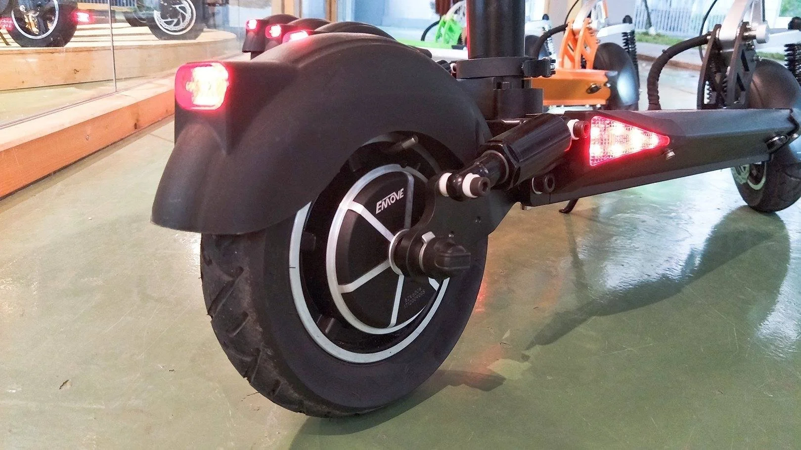 The eMove Cruiser has a rear brake light, and lighting integrated into the wide deck
