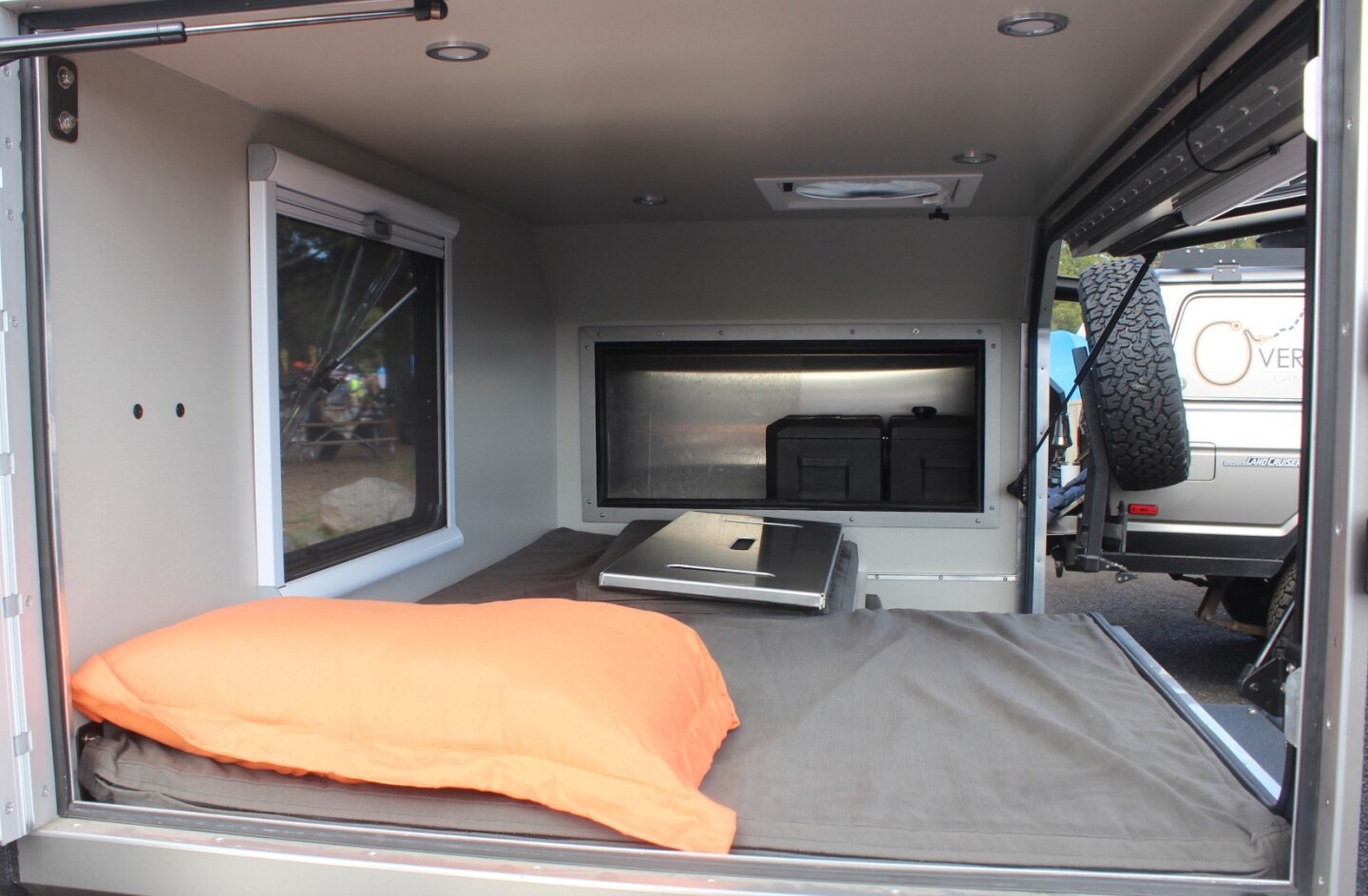 Inside, you can see the removable panel that creates a functional seat for more naturally sitting up to eat or work